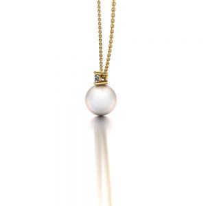 Yellow gold Akoya pearl and diamond pendant necklace side view